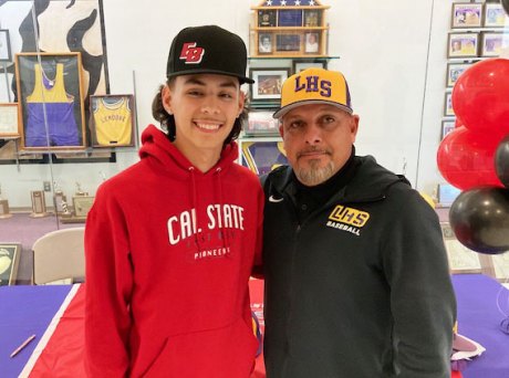 Dominick Najor, bound for Cal State East Bay, with his head coach, Izzy Gonzalez.
